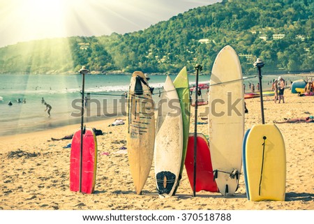Multicolored surfboards at  Kata Beach in Phuket Island - Surf boards at tropical exclusive destination in south east Asia - Wonders of Thailand on vintage filtered look with enhanced sunshine