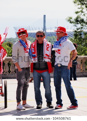 EURO 2012 FOOTBALL SUPPORTERS IN WARSAW, POLAND - JUNE 7: Polish supporters in Warsaw on June 7, 2012. Warsaw will host the opening match of the UEFA Euro 2012.