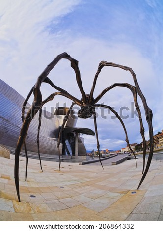 BILBAO, SPAIN - MARCH 8, 2013: Maman - spider sculpture by the artist Louise Bourgeois in front of The Guggenheim Museum in Bilbao, Biscay, Basque Country, Spain