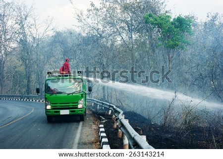 CHIANGMAI, THAILAND - MARCH 4: Fire Trucks on a road to prevent the wildfire cross the road, in Chiangmai, Thailand on March 4, 2015