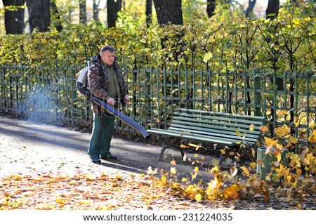 St. Petersburg, Russia, 18 OCTOBER: autumn cleaning fallen leaves in the Summer garden on October 18, 2014,  St. Petersburg, Russia