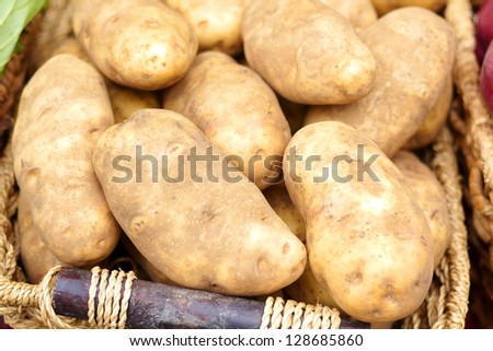 Close-up of raw potatoes for sale at the market. Horizontal Shot.