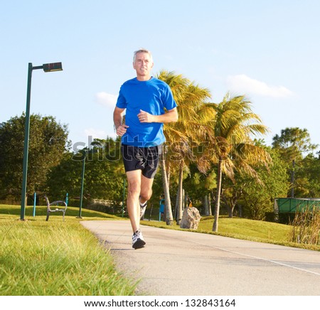Full length of a mature man jogging Horizontal shot Full length of a mature man jogging Horizontal shot