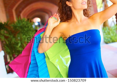 beautiful smiling young woman with shopping bags. Horizontal Shot.