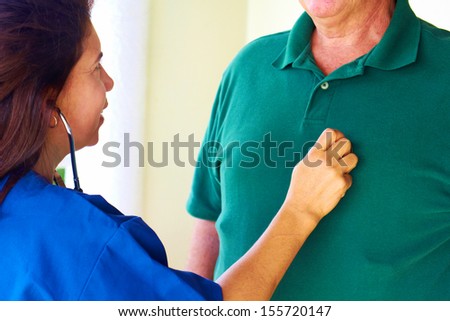 Home health care of a nurse taking care of senior man