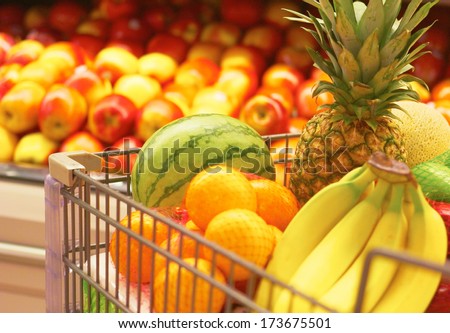 Shopping Cart Full Of Fruit at the supermarket. Selective Focus, Grocery Shopping for fruit.