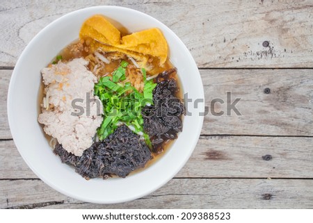 Noodle with algae Thai food style on wood background