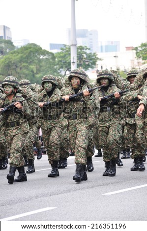 KUALA LUMPUR - AUGUST 31: Women infantry soldiers from the Malaysian Armed Forces march during Malaysia\'s Independence Day parade on August 31, 2014 in Kuala Lumpur, Malaysia.