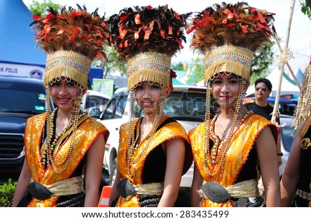 KOTA KINABALU, MALAYSIA - MAY 30, 2015: Group of young Women of Kadazandusun ethnic in traditional costumes pose for guests during the State Harvest Festival Celebration in Kota Kinabalu, Sabah.