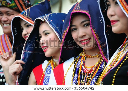 Kota Kinabalu, Malaysia - May 30, 2015: A beautiful Kadazan Dusun girls in traditional costume during the Sabah State Harvest Festival Celebration in Kota Kinabalu, Sabah.
