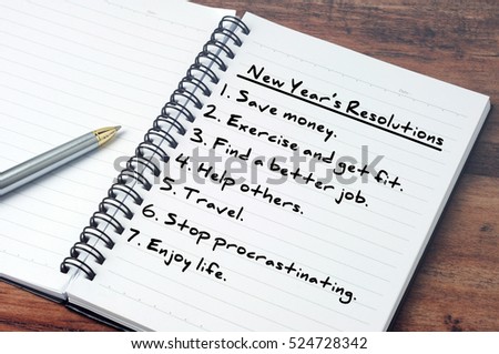 List of New Year\'s resolution on notepad, vintage style.