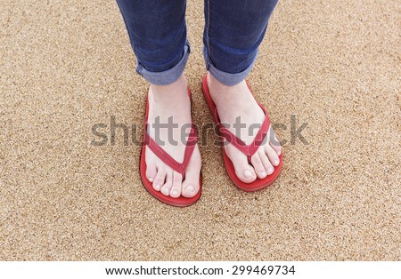 flip flops on a woman on the beach