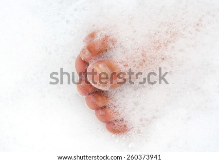 Toes in bath foam