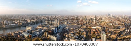 London Cityscape Aerial Panorama View feat. Houses of Parliament in Westminster on Thames River, Famous British Landmarks Skyline with Wide Panoramic Birds Eye View in England, United Kingdom UK