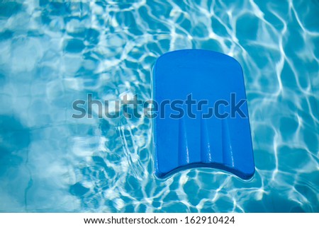 Blue board for swimming at the pool