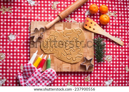 Cutting gingerbread cookie dough for Christmas and New Year
