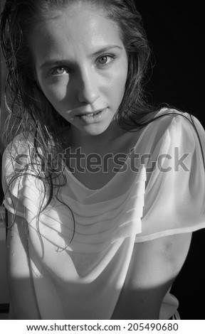 black and white portrait of a girl model on a black background