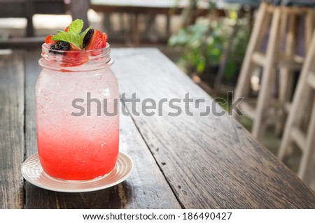 strawberry italian soda decorate with  strawberry, mulberry and mint