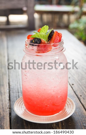strawberry italian soda decorate with  strawberry, mulberry and mint
