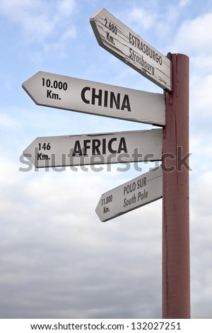 Crossroads Sign indicating the distance to China, Africa North Pole and Strasbourg.