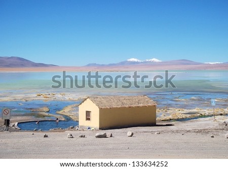 hut at the lake in the mountains of bolivia mountain lake Panorama\
\
lagoon in the hills