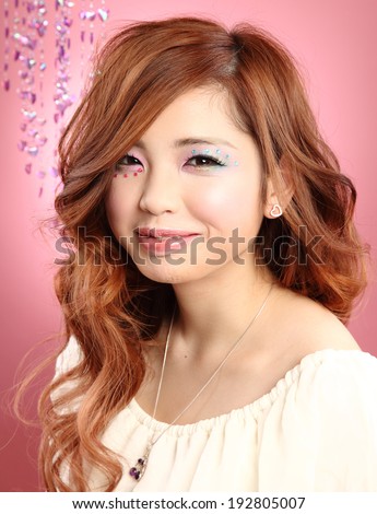 Beautiful Japanese girl/A Japanese beauty/A beautiful Japanese teenage girl portrait shot on a pink background. Shot in studio