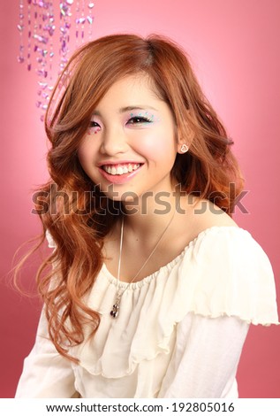 Beautiful Japanese girl/A Japanese beauty/A beautiful Japanese teenage girl portrait shot on a pink background. Shot in studio