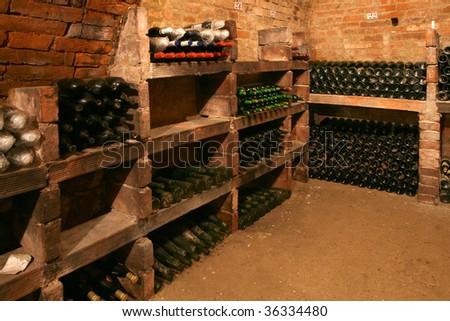 very old bottles in wine cellar