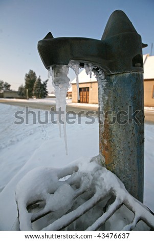 Frozen old water pump in Czech village