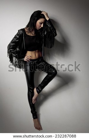 Fashion Rocker Style Model Girl Portrait. Rocker or Punk Woman Makeup