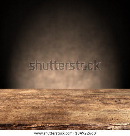 wooden desk and dark wall