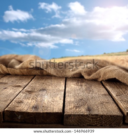 sun blue sky and brown table of dirty wood