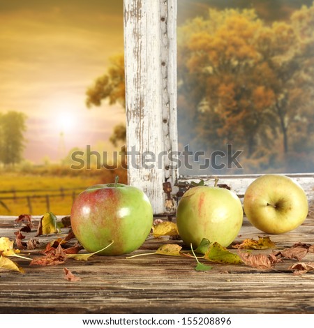 few apples on window sill of wood