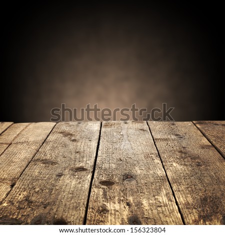 dark wooden desk and brown wall