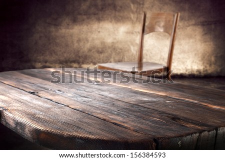 dark brown table and worn old wall