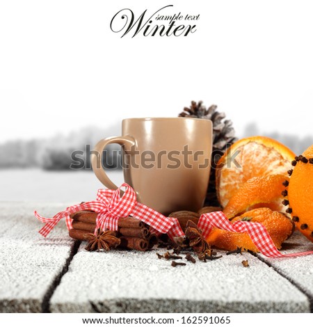cup of drink and orange and snow