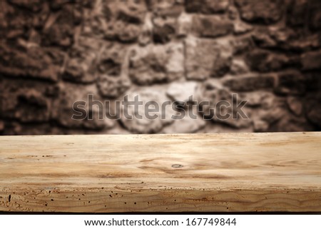 wooden desk and dark retro wall