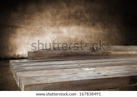 desk in dark room with empty space