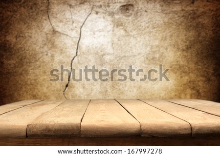 old worn table of wood and old worn wall