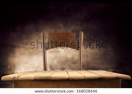 chair and table of wood in dark interior