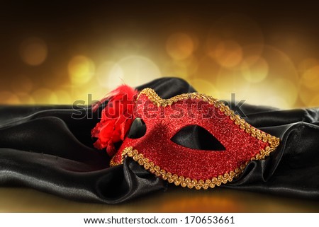 carnival mask and black satin with golden space