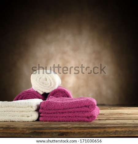 white and red towel on desk in brown interior