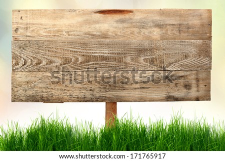 wooden banner and grass