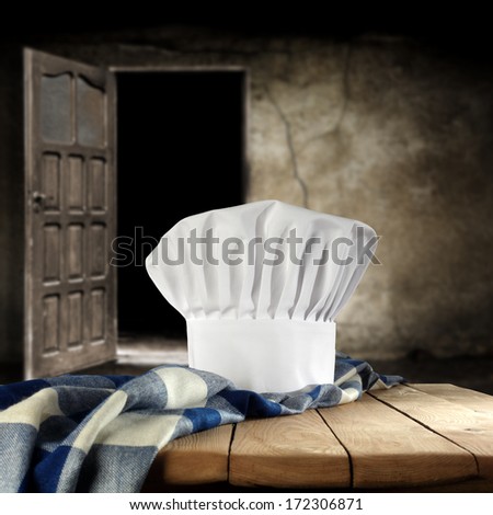 blue and white napkin and door with cook hat