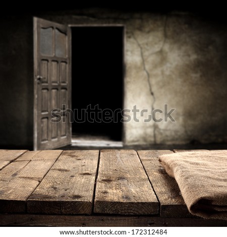 open door and napkin on old table