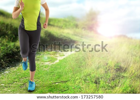 green landscape of spring and woman running