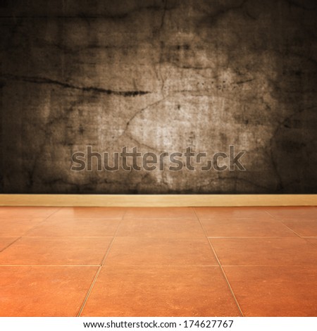 dark dirty wall and brown floor in room