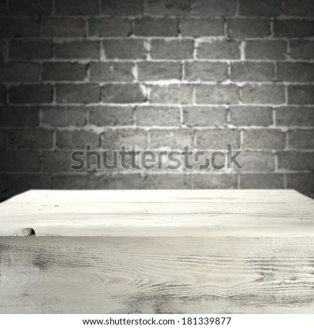 white shabby desk and gray wall