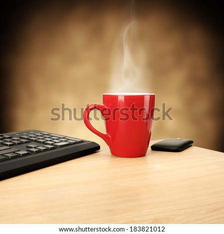 red mug on yellow desk