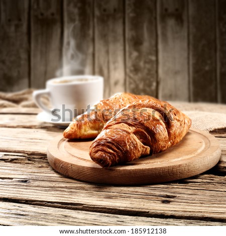 croissants and cup of warm drink